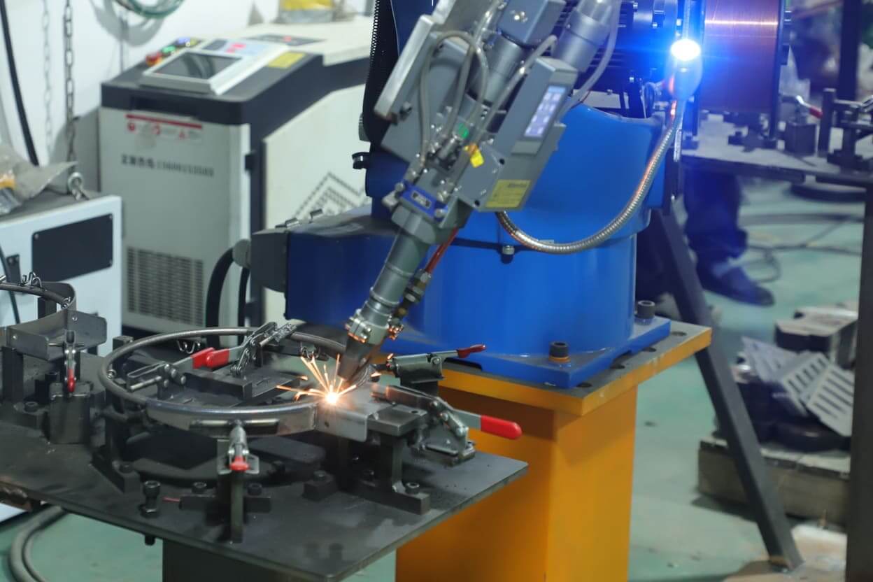 Robotic arm automatic laser welding machine processing metal hardware parts in Yizhijie factory
