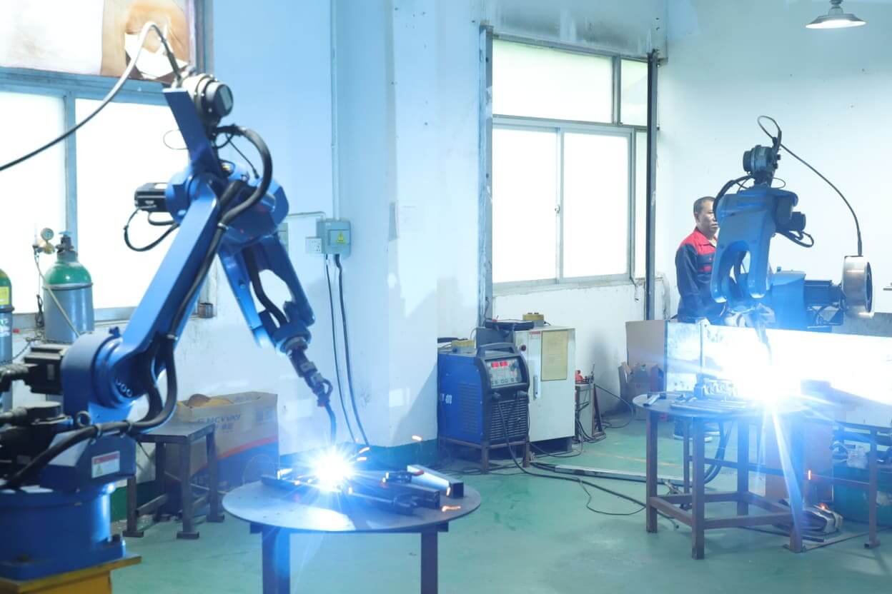 Robotic arm MIG welding station for metal hardware manufacturing at Yizhijie factory